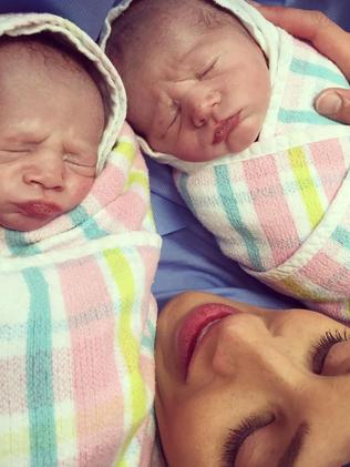 Bec Judd with her twins, Darcy on the left, Tom on the right.