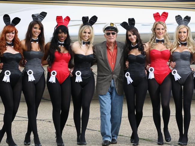 Playboy founder Hugh Hefner (centre) arrives at Stansted Airport on June 2, 2011 in Stansted, England to mark the launch of the new Playboy Club in Mayfair. Famous Bunnies have included Debbie Harry and Lauren Hutton. Picture: Getty