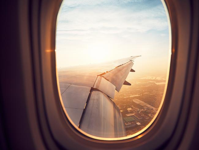 ESCAPE: How to score a random flight upgrade, by Lisa MayohiStockView from the window of the airplane at the sunrise. Landing in Bangkok, Thailand.