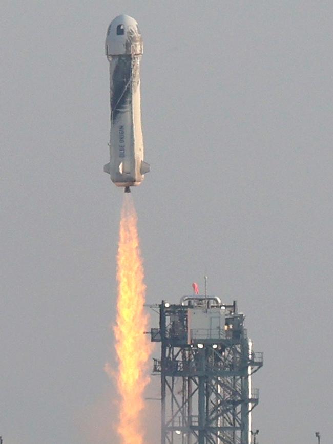 The New Shepard Blue Origin rocket lifts-off from the launch pad on Tuesday in Van Horn, Texas. Picture: AFP