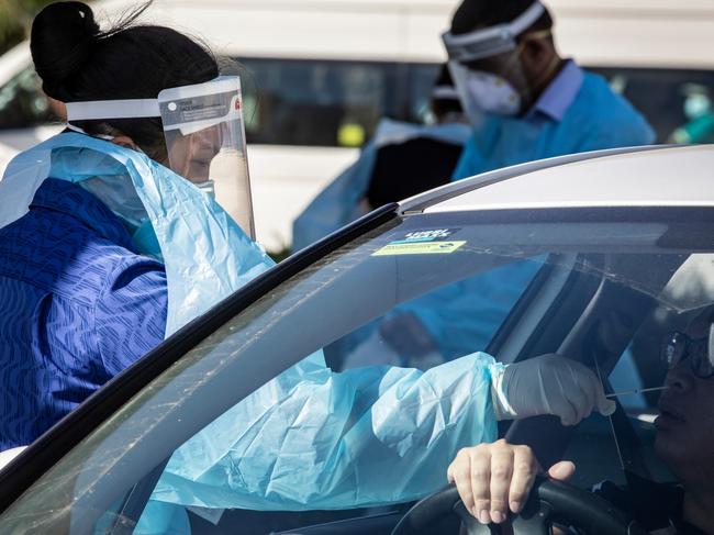 PERTH, AUSTRALIA  - NewsWire Photos FEBRUARY 2, 2021: Medicos attend to people at the Orrong Road the site of a drive through test facility asPerth starts its second day of a 5 day lockdown after a man tested positive to Covid 19. NCA NewsWire / Tony McDonough