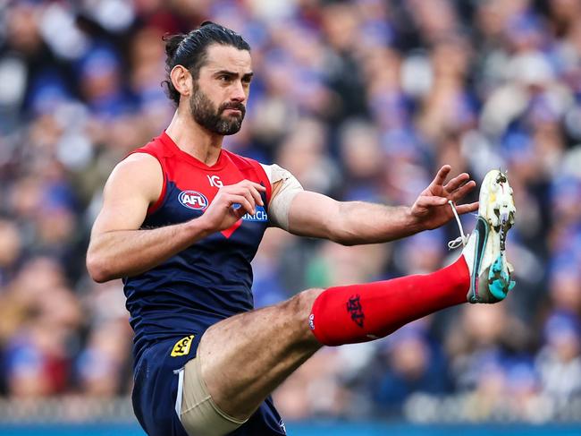 MELBOURNE, AUSTRALIA - JUNE 12: Brodie Grundy of the Demons kicks the ball during the 2023 AFL Round 13 match between the Melbourne Demons and the Collingwood Magpies at the Melbourne Cricket Ground on June 12, 2023 in Melbourne, Australia. (Photo by Dylan Burns/AFL Photos via Getty Images)