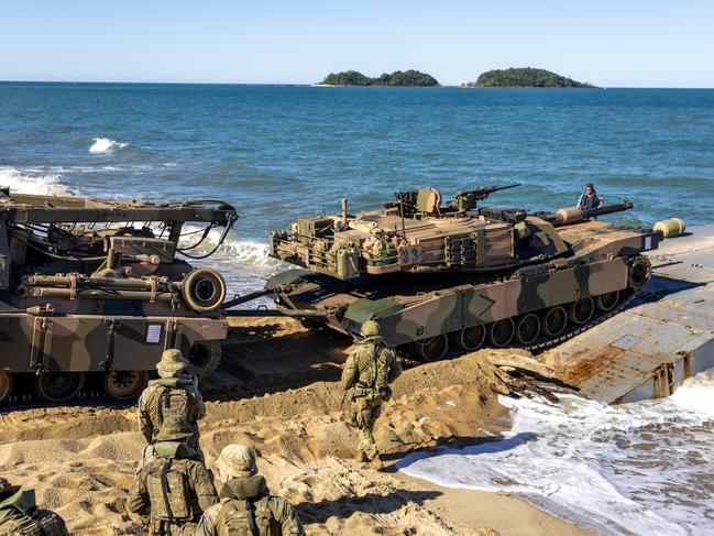 Soldiers from the Australian Amphibious Force use an M88 Recovery Vehicle to drive an M1A1 Abrams onto a MEXEFLOTE in a recovery scenario.  Photo: CAPT Annie Richardson