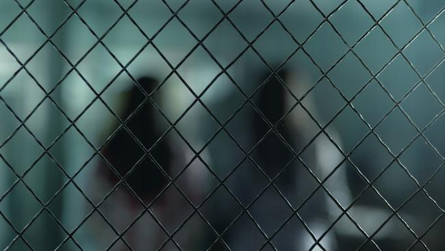Woman in prison generic background