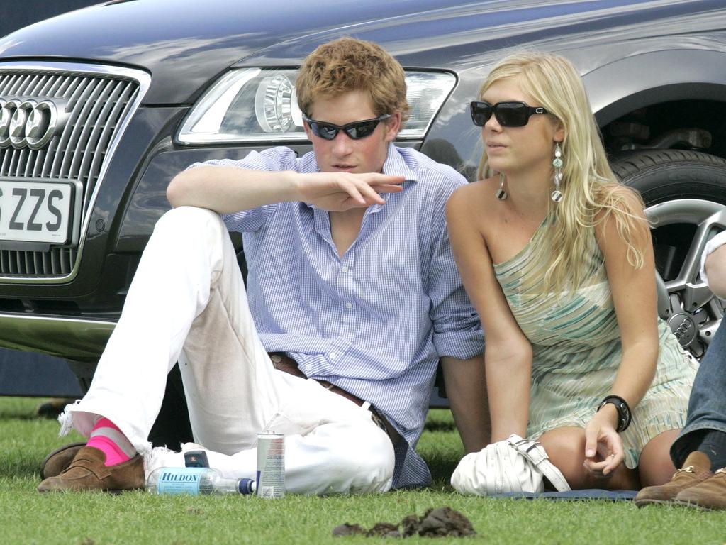 Prince Harry and his girlfriend Chelsy Davy attend the Cartier International Polo match at the Guards Polo Club on 30 July, 2006 in Egham, England. (Photo by MJ Kim/Getty Images)