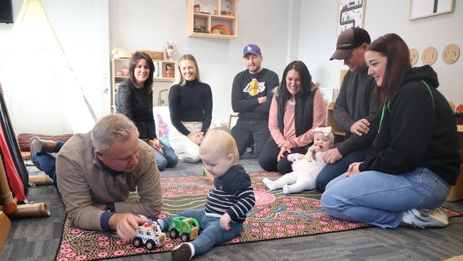 Premier Jeremy Rockliff entertains a baby at Lydia’s Tiny Tots Retreat in Launceston. Picture: Supplied