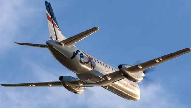 Adelaide, Australia - REX (Regional Express Airlines) Saab 340 twin engined regional commuter aircraft taking off from Adelaide Airport.Escape 15 October 2023Doc HolidayPhoto - iStock