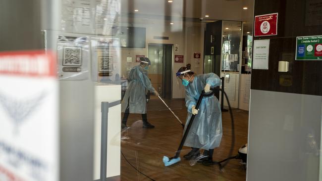 Cleaners in full PPE disinfection the Melbourne Airport Holiday Inn on Wednesday. Picture: Diego Fedele/Getty Images