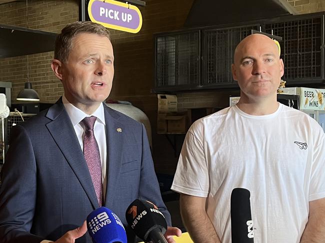 Minister Michaels, Treasurer Mulligan and Joe Anderson, Director of One Sneaky Cheetah, announcing the lifting of the cap on the EEG Round 2. Picture: Karen Grace Prince