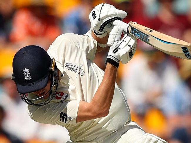 BRISBANE, AUSTRALIA - NOVEMBER 26: Jake Ball of England avoids a delivery by Pat Cummins of Australia during day four of the First Test Match of the 2017/18 Ashes Series between Australia and England at The Gabba on November 26, 2017 in Brisbane, Australia.  (Photo by Cameron Spencer/Getty Images)