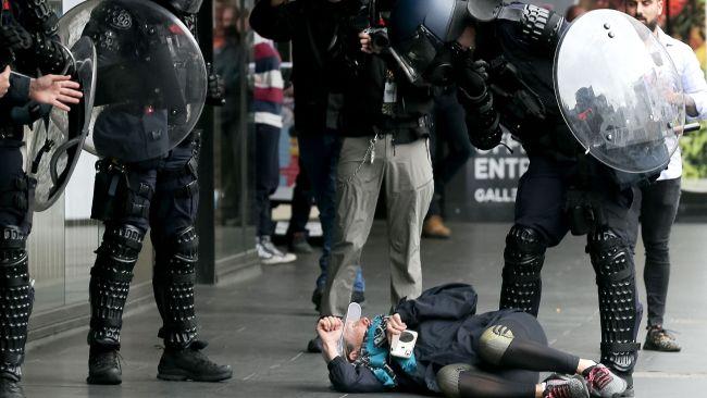 Anti-riot police detain a protester. Picture: Con Chronis/AFP
