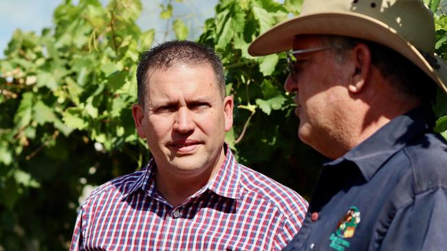 Labor candidate for Flynn, Matt Burnett, with Paul Wortley from Evergreen Farms, at Evergreen Farms.