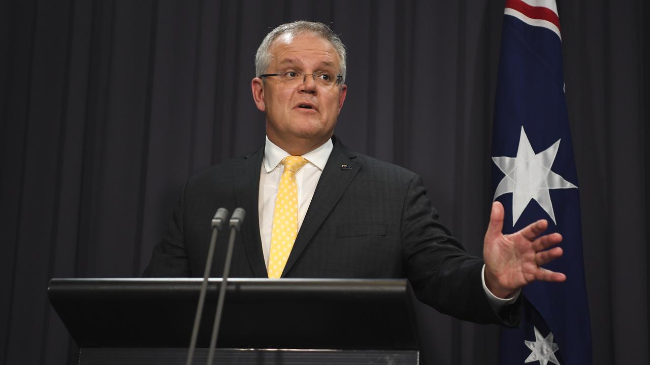 Prime Minister Scott Morrison said Australians should stay at home, while the text message advises people to stay at home if they are sick. Picture: Lukas Coch/Pool/Getty Images