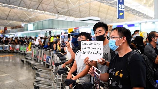 Hong Kong pro-democracy protesters block the departure gates during another demonstration against police brutality and a controversial extradition bill. Picture: AFP