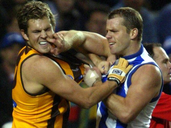 16/08/2003. Glenn Archer and Luke Hodge push and shove. Kangaroos v Hawthorn. Telstra Dome. Digital image.