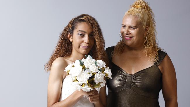 Kayleen Murray models a $270 wedding dress and Donna Corrie models a $30 dress that is on sale from the St Vincent de Paul society's opportunity shop at the Showgrounds Shopping Centre, Mulgrave Road, Bungalow. Picture: Brendan Radke