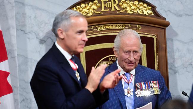 Canada's Prime Minister Mark Carney claps after King Charles III delivered the Speech from the Throne during the opening the first session of the 45th Parliament of Canada at the Senate of Canada in Ottawa. Picture: AFP