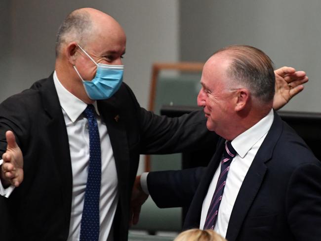 Liberal member for Swan Steve Irons is hugged by Minister for Employment Stuart Robert after making his valedictory speech in parliament in March. Picture: AAP Image/Mick Tsikas