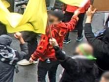 Caption: A man accused of waving the flag of a declared terrorist organisation at a CBD rally is expected to face court next month.