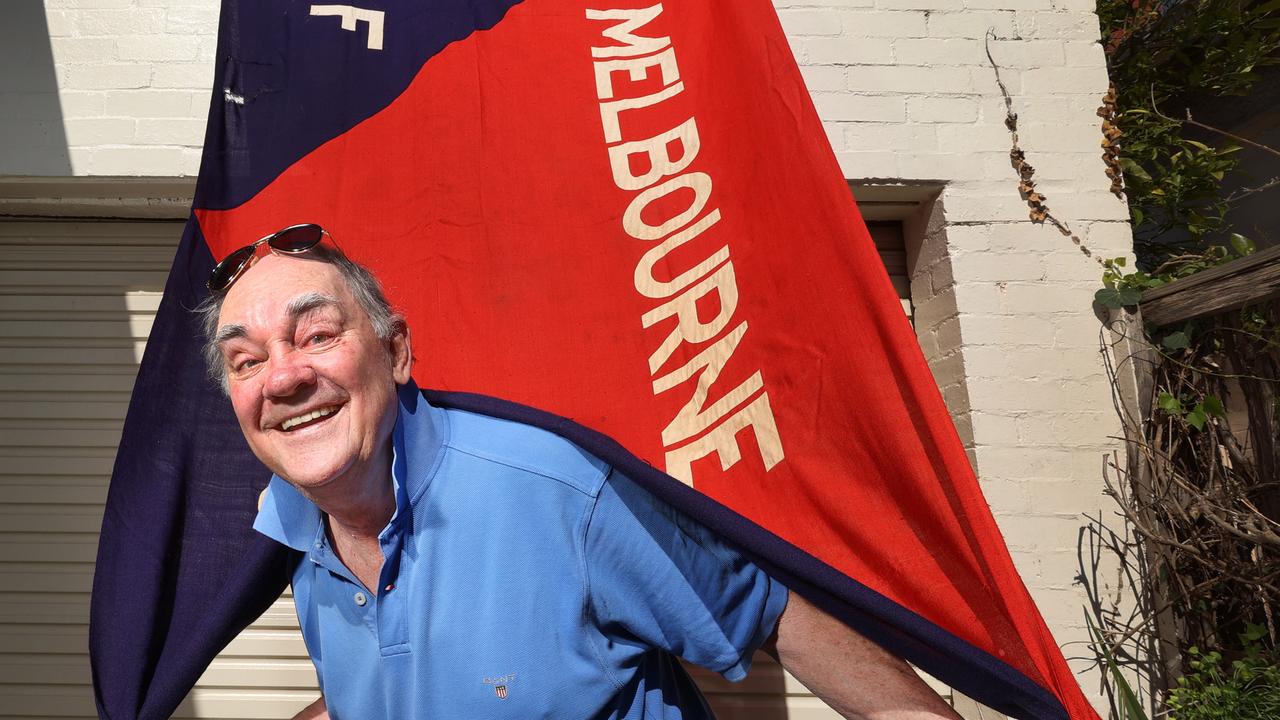 Burns with the recently unearthed, antique Melbourne Football Club flag. Picture: David Caird