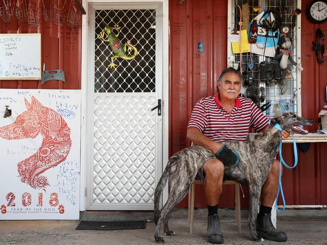 Greyhound trainer and the last greyhound owner committee member Cliff Bell with one of his dogs Rudy at this Marshall Mount home. Picture: Jonathan Ng