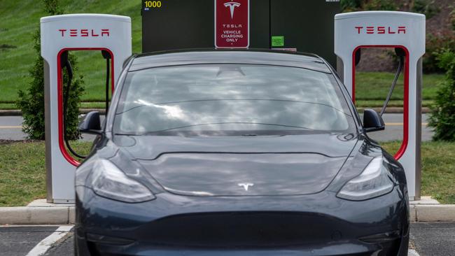 A Tesla electric vehicle charges in Arlington, Virginia. Picture: AFP