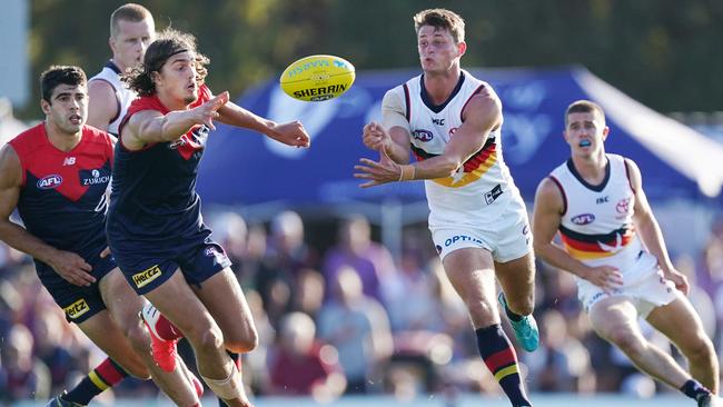 Adelaide’s Matt Crouch releases a handball in from of Melbourne’s Luke Jackson in last weekend’s Marsh Series match. Picture: AAP Image/Michael Dodge