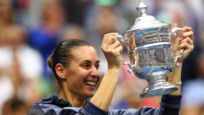 NEW YORK, NY - SEPTEMBER 12: Flavia Pennetta of Italy celebrates with the winner's trophy after defeating Roberta Vinci of Italy during their Women's Singles Final match on Day Thirteen of the 2015 US Open at the USTA Billie Jean King National Tennis Center on September 12, 2015 in the Flushing neighborhood of the Queens borough of New York City. Pennetta defeated Vinci 7-6, 6-2. (Photo by Clive Brunskill/Getty Images)