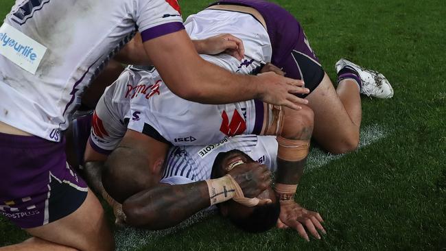 Suliasi Vunivalu celebrates Melbourne’s grand final win in his final game before he switches to rugby union next season. Picture: Brett Costello