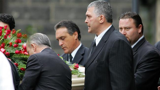 Mick Gatto carries the casket holding Mario Condello.