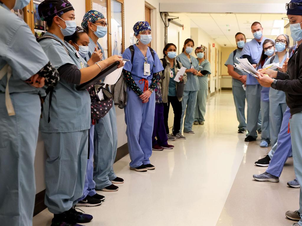 Clinicians attend a 'shift huddle' during shift change at an ICU in California. Picture: AFP