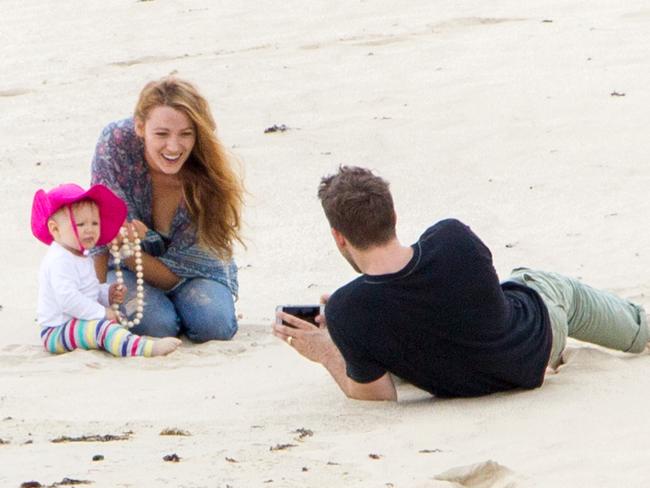 Ryan took some snaps of his wife and daughter playing in the sand.