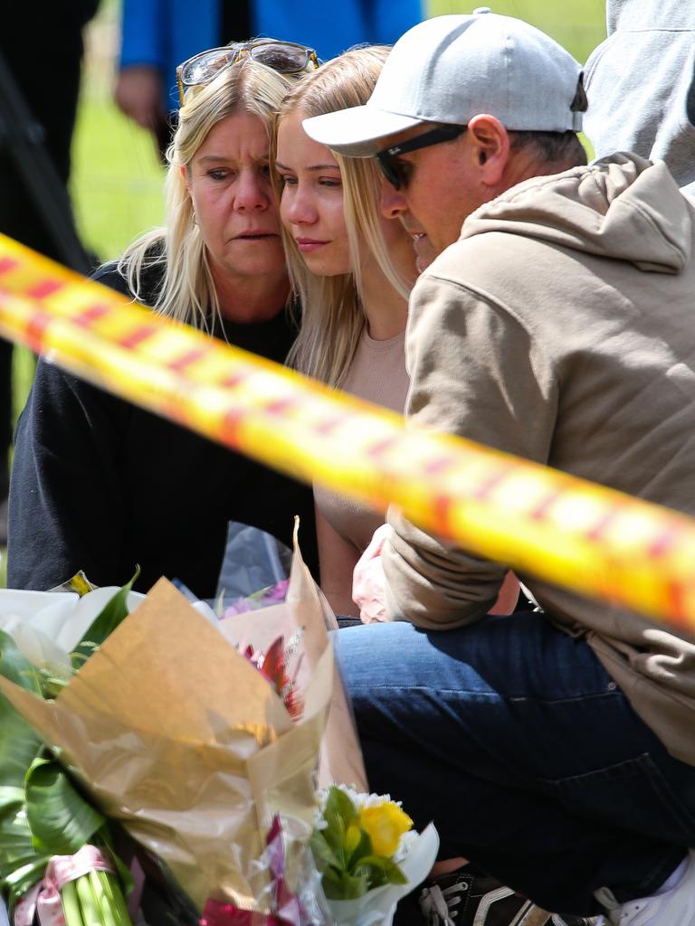 A young girl arrives with her family to pay her respects. Picture: NCA Newswire /Gaye Gerard