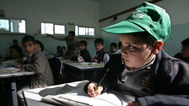 A young boy wears a Hamas cap at Dar al-Akram school in Gaza City in 2006. Picture: AFP