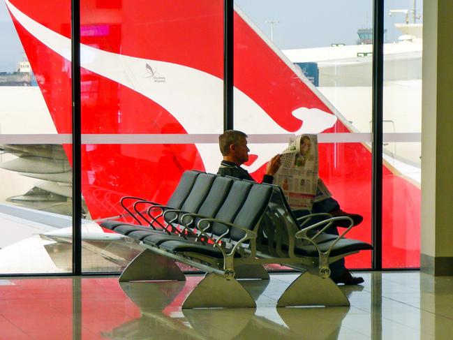 Botany Bay, Australia - June 21, 2009: The tailplane of a Qantas plane is viewed through the window of the departure lounge at Kingsford Smith Airport in Sydney. For: Where, why and when in 2020. Credit: Istock