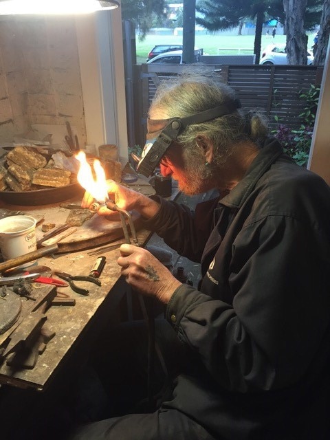 Bondi's bespoke jeweller Zuzy Noy (pictured at his workshop) is exhibiting handcrafted silver sea creature collars, bold brass bathing beauty brooches and outrageous one-off silver sunnies set with turquoise, ebony and mother-of-pearl for two weeks at Nimbella in Bangalow.