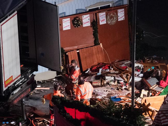 Authorities worked amid a trail of devastation at the Christmas market near the Kaiser Wilhelm Memorial Church in Berlin, Germany. Picture: AP