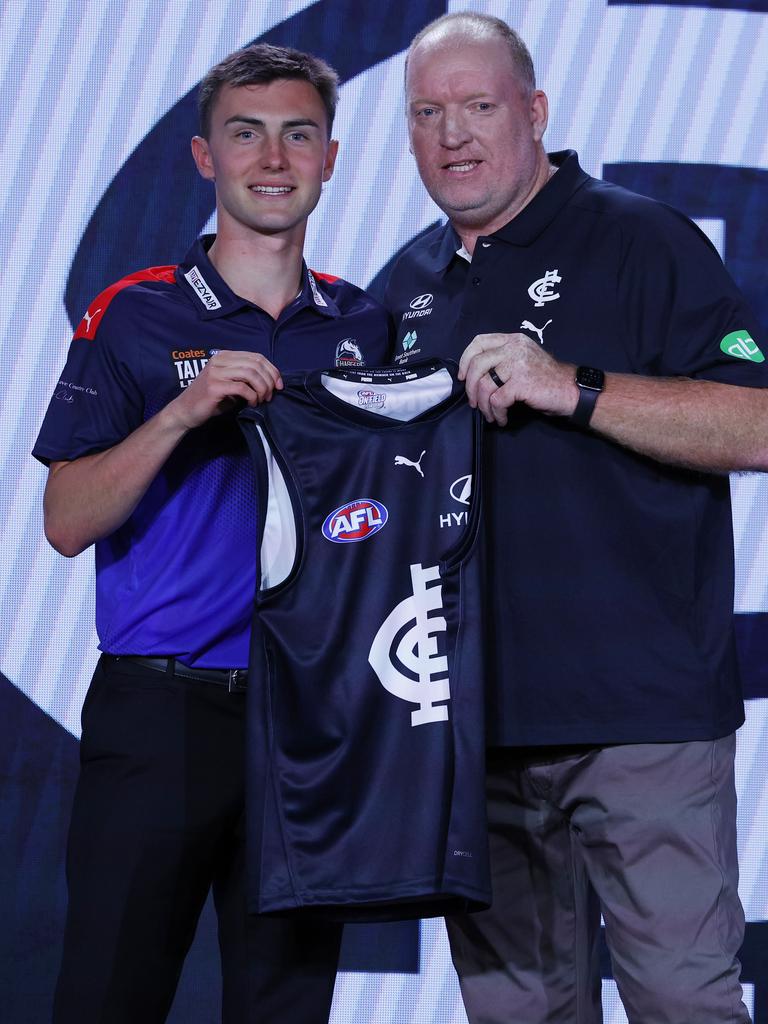 Smith receives his Carlton jumper from Lance Whitnall. Picture: Michael Klein