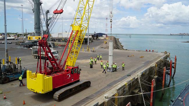 US sailors and logisticians reload the USS Dewey with a missile at a naval base in Darwin, Australia. Picture: Mike Cherney/WSJ