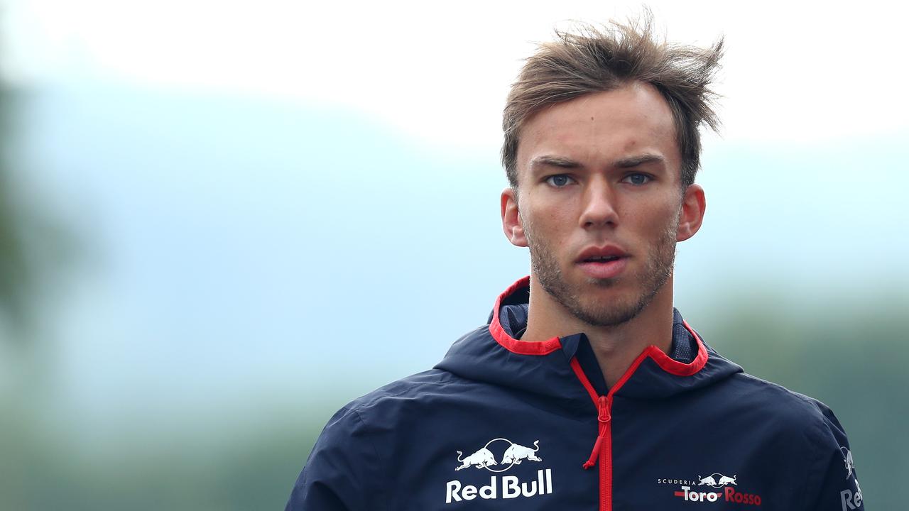 Pierre Gasly walks in the paddock at Spa-Francorchamps in his Toro Rosso colours.