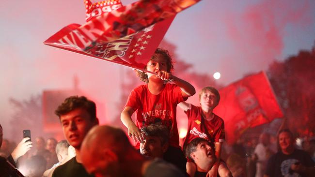 LIVERPOOL, ENGLAND - JUNE 25:  Liverpool fans celebrate as their team clinches the Premier League title at Anfield on June 25, 2020 in Liverpool, England. Liverpool are crowned Premier League champions as nearest rivals Manchester City fail to be Chelsea. Liverpool claim their first championship in 30 years. (Photo by Jan Kruger/Getty Images)