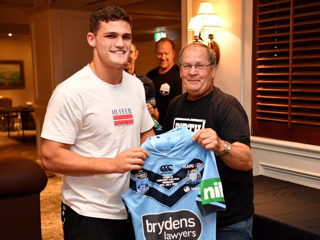 Tommy Raudonikis presents a jersey to Nathan Cleary in Brisbane in 2018.