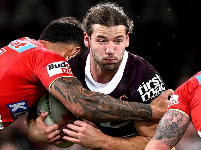 BRISBANE, AUSTRALIA - JULY 01: Patrick Carrigan of the Broncos takes on the defence during the round 18 NRL match between Brisbane Broncos and Dolphins at The Gabba on July 01, 2023 in Brisbane, Australia. (Photo by Bradley Kanaris/Getty Images)