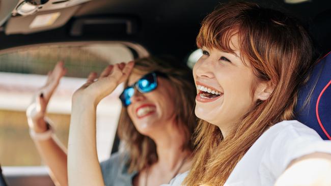 At Home 2023: April 1 issue, The Fixer, smells like teen spirit. Picture: iStockHappy excited pretty young woman waving with hands when riding in car