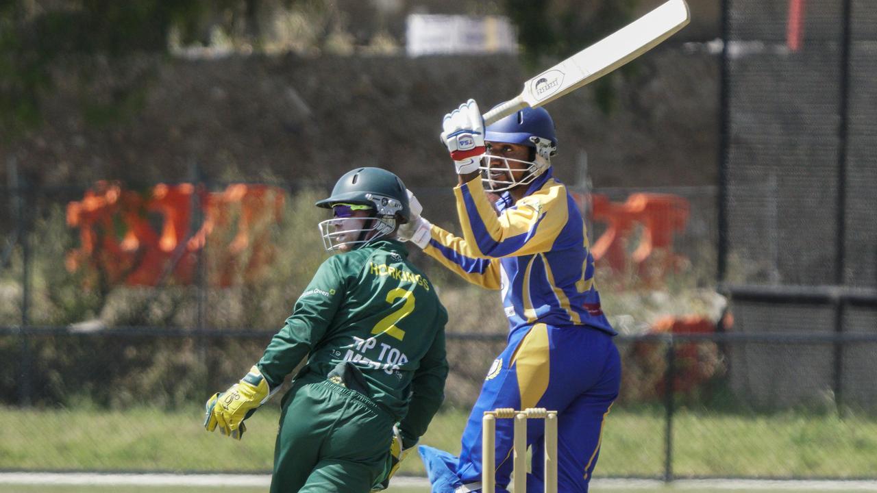 Noble Park’s Kolitha Weerasekera gets this one away. Picture: Valeriu Campan