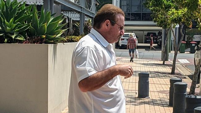 Kent Paul Scarborough, rushes from Southport Courthouse into a waiting car on Friday, November 15, 2019. Picture: Luke Mortimer