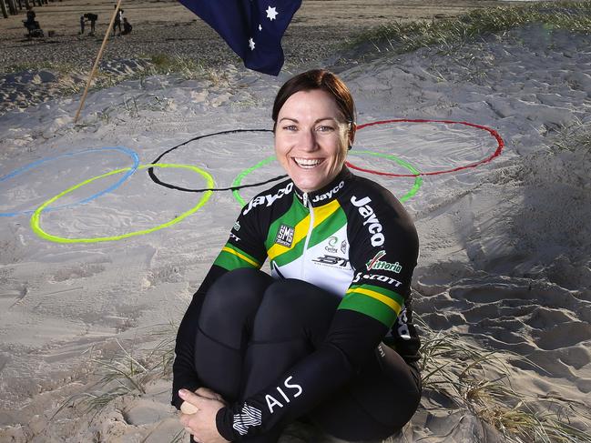 EMBARGOED - NO INTERNET - TO BE HELD - DO NOT USE WITH PERMISSION FROM THE PICTORIAL EDITOR. Australia's cycling queen Anna Meares, ready for what will be her last Olympics. Pictured at Grange beach with the Olympic rings in the sand. Picture Sarah Reed