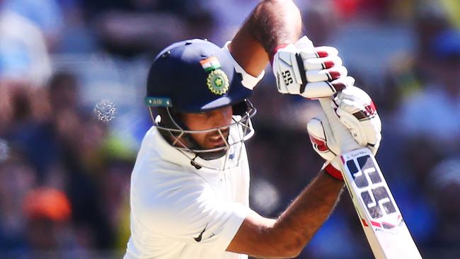 Debutant Mayank Agarwal of India drives against Australia at the MCG. Picture: Getty Images