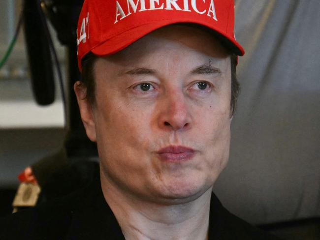 (FILES) Elon Musk looks on during a Cabinet meeting in the Cabinet Room of the White House in Washington, DC, of April 30, 2025. Mega-billionaire Elon Musk said May 20, 2025 he has contributed enough to political campaigns and would spend 