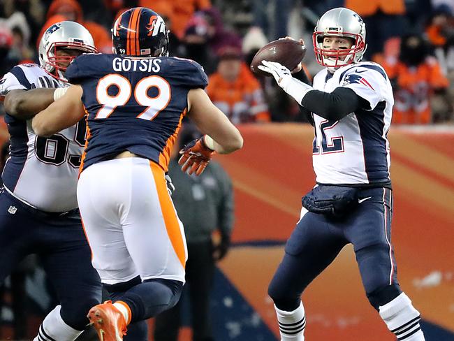 Adam Gotsis fights through a block from New England's Shaq Mason with Tom Brady in his sights. (Photo by Matthew J. Lee/The Boston Globe via Getty Images)